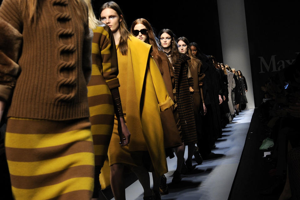 Models wear creations for Max Mara women's Fall-Winter 2013-14 collection, part of the Milan Fashion Week, unveiled in Milan, Italy, Thursday, Feb. 21, 2013. (AP Photo/Giuseppe Aresu)