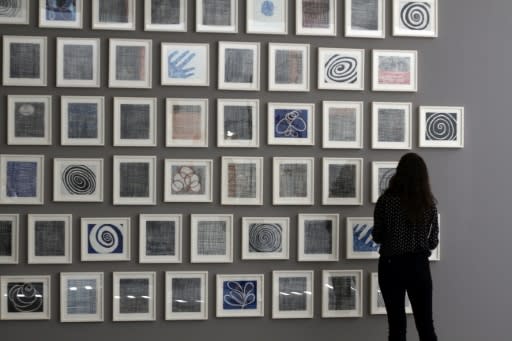 A woman looks at "Je t'aime" (2005), a series of 60 double-sided drawings by Louise Bourgeois, at Glenstone museum in Potomac, Maryland on May 8, 2018