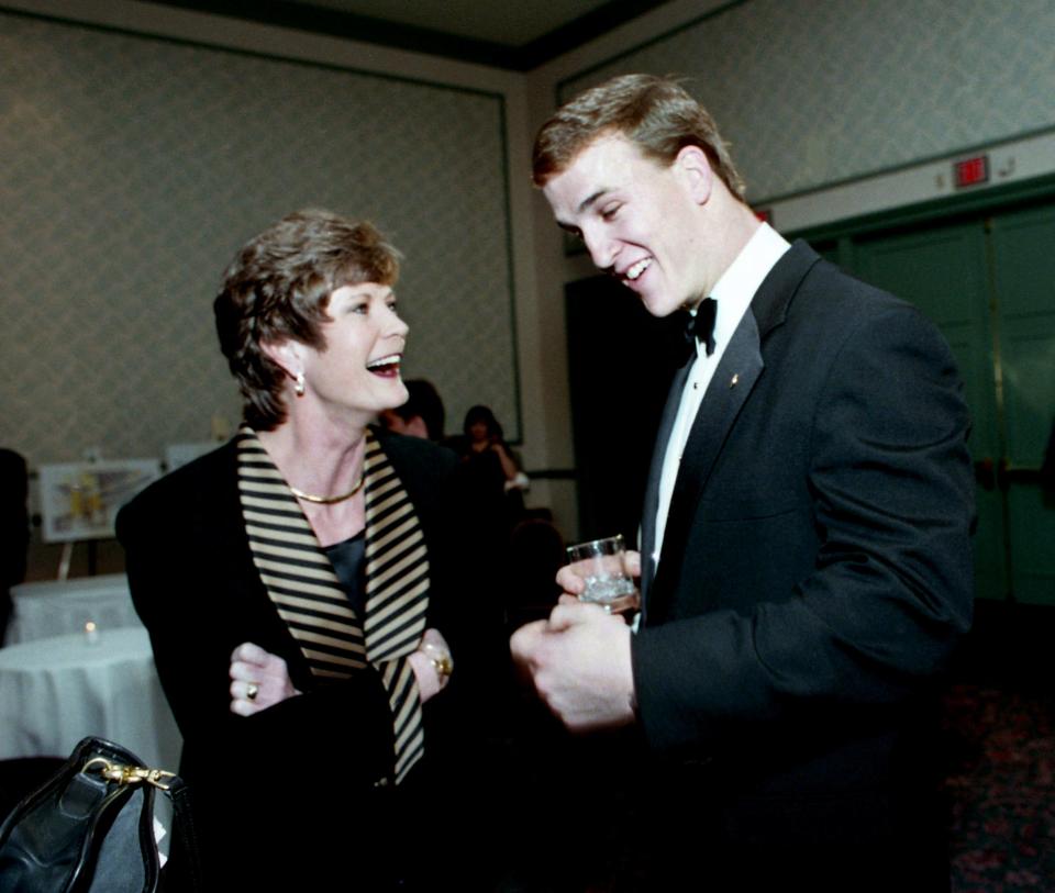 Former Tennessee quarterback Peyton Manning, right, shares a laugh with Tennessee women's basketball coach Pat Summitt during the Tennessee Sports Hall of Fame induction ceremonies Feb. 20, 1998, in downtown Nashville.