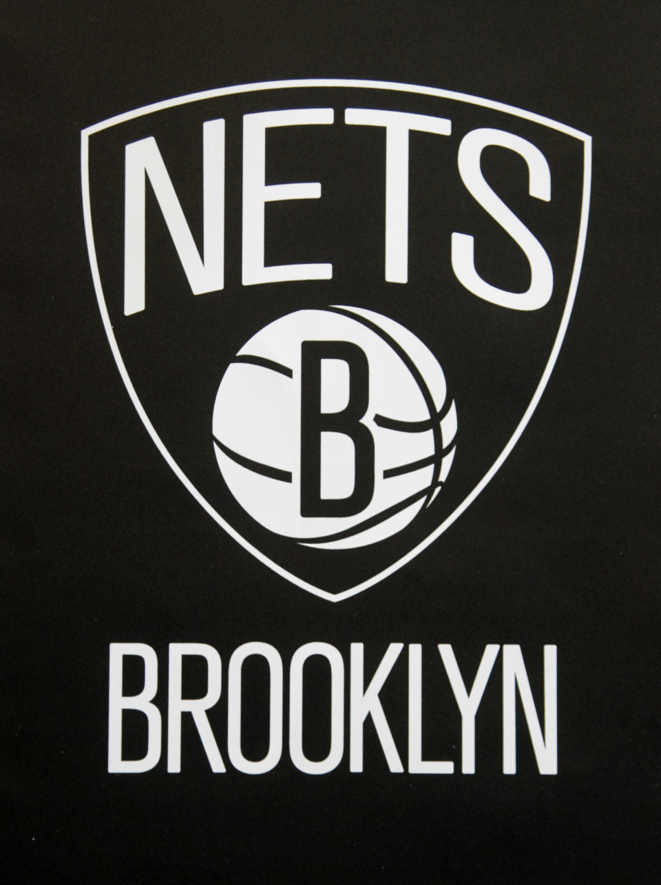 One of the new Brooklyn Nets logos is displayed during a news conference in the Brooklyn borough of New York, Monday, April 30, 2012. The Nets will be moving from New Jersey to the new Barclays Center in Brooklyn for the 2012-2013 NBA basketball season. (AP Photo/Seth Wenig)