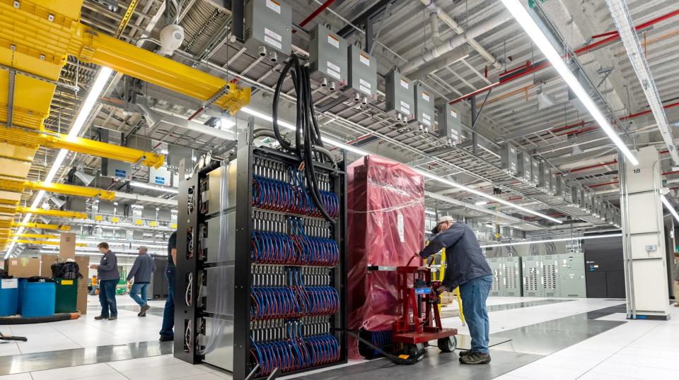 Workers install the cabinets in the Frontier center last year. It took from between September-November of 2021 to install the supercomputer.