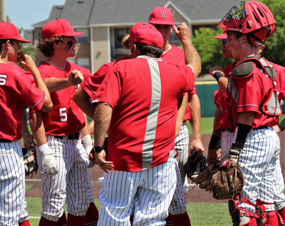 Anson coach Scotty Nichols, center, reminded his team time and again Saturday in Game 3 to keep fighting. The Tigers fell behind New Home 7-0 and made up all by one run of the deficit in a 13-12 loss in the Region I-2A semifinal.