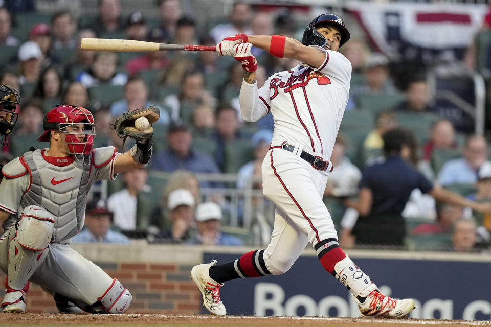 Atlanta Braves left fielder Eddie Rosario (8) takes a strike against the Philadelphia Phillies in the second inning of Game 2 of a baseball NL Division Series, Monday, Oct. 9, 2023, in Atlanta. (AP Photo/Brynn Anderson)