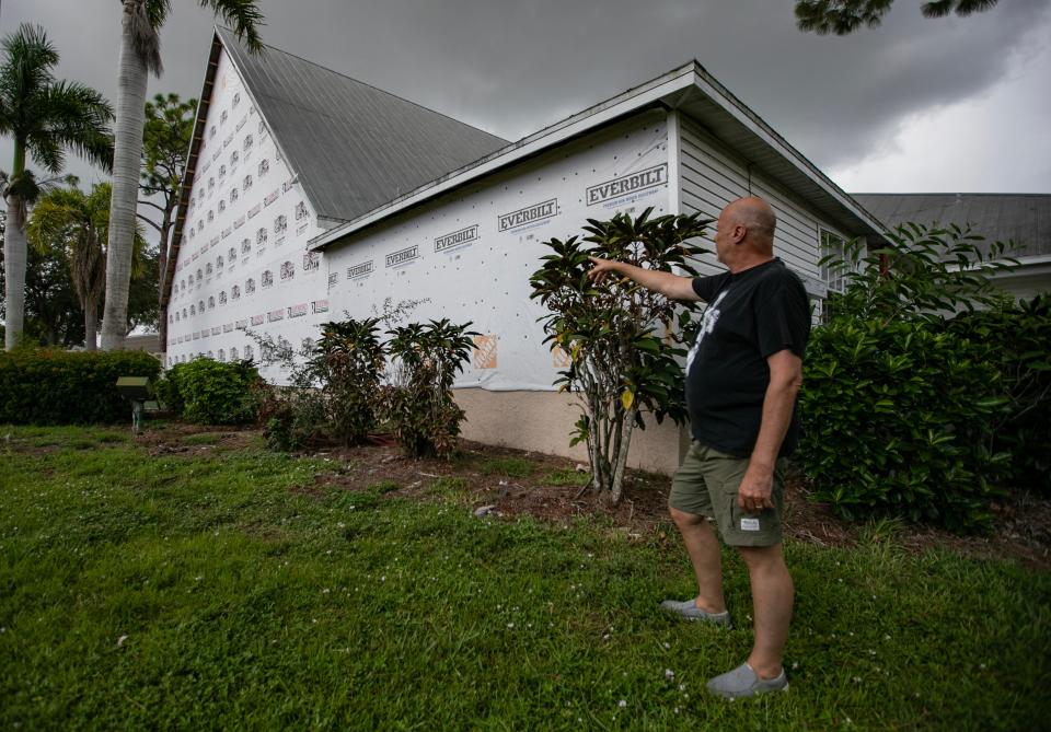 Tommy Dennis, lead pastor at Cape Coral Community Church, explains some of the damage and current rebuild work ongoing inside of the main church building. The church was extensively damaged after the impact of Hurricane Ian and remains with limited accessibility for its members. Dennis had been holding service in a tent in the parking lot but with excessive high temperatures during the summer months, he now holds services on the outside porch. The congregation remains waiting on insurance mediation and permits to do work.