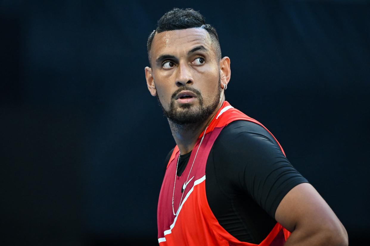 Nick Kyrgios of Australia reacts in his second round singles match against Daniil Medvedev of Russia during day four of the 2022 Australian Open at Melbourne Park