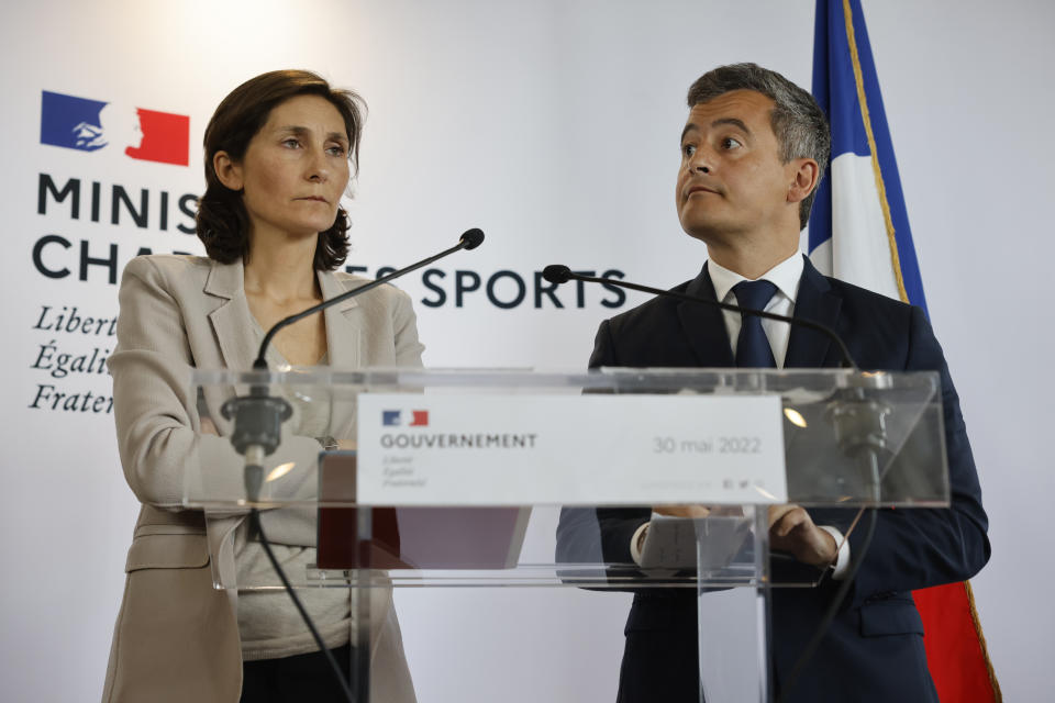 Sports Minister Amélie Oudéa-Castéra, left, and French Interior Minister Gerald Darmanin attend a press conference following a meeting on security after incidents during the Champions League final at the Stade France stadium, Monday, May 30, 2022 in Paris. The British government says it's deeply concerned over the treatment of Liverpool supporters by French authorities, who blamed fans for unrest at the Champions League final amid overcrowding outside the Stade de France. (AP Photo/Jean-Francois Badias)