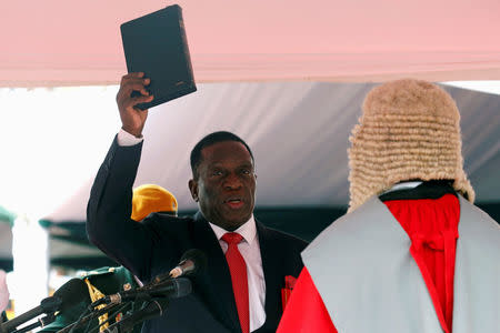 FILE PHOTO: Emmerson Mnangagwa is sworn in as Zimbabwe's president in Harare, Zimbabwe, November 24, 2017. REUTERS/Mike Hutchings/File Photo