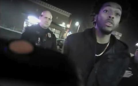 This Jan. 26, 2018 police body-camera footage released by Milwaukee Police Department shows NBA Bucks guard Sterling Brown talking to arresting police officers - Credit: AP