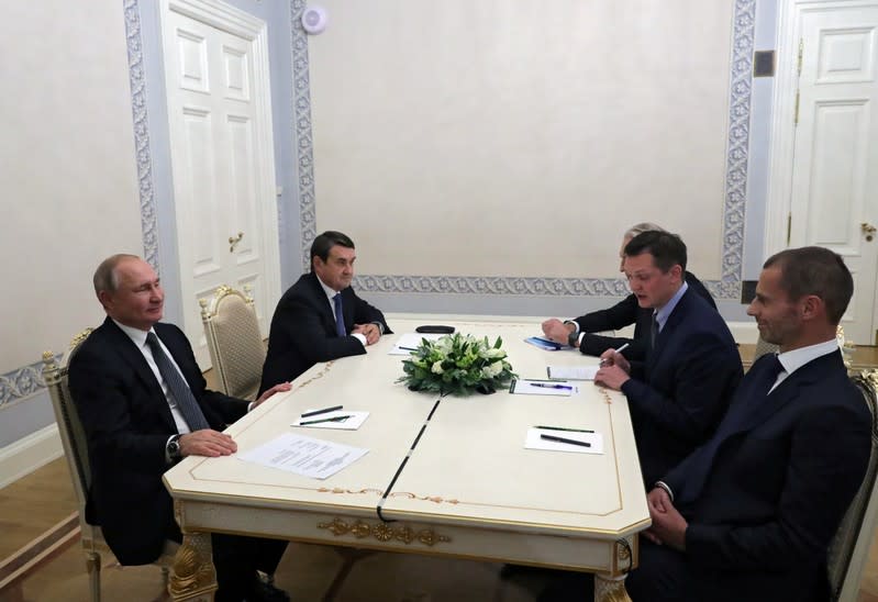 Putin attends a meeting with UEFA President Ceferin in Saint Petersburg