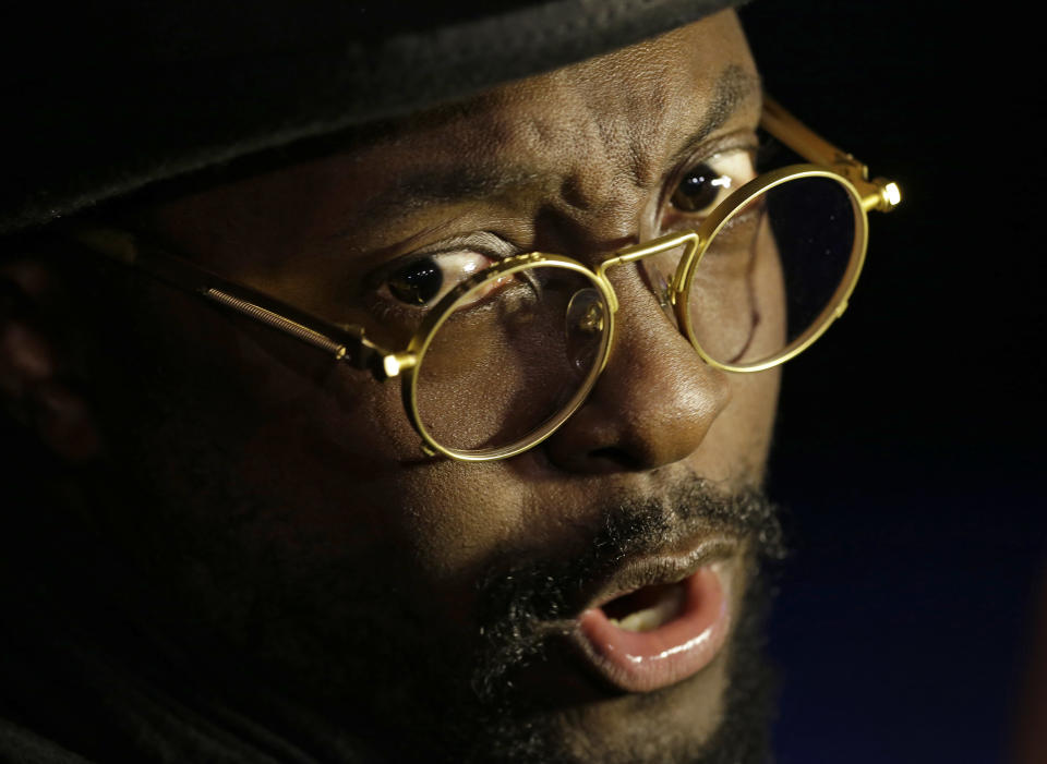 Will I. Am is interviewed during The Inaugural Ball at the Washignton convention center during the 57th Presidential Inauguration in Washington, Monday, Jan. 21, 2013. (AP Photo/Paul Sancya)