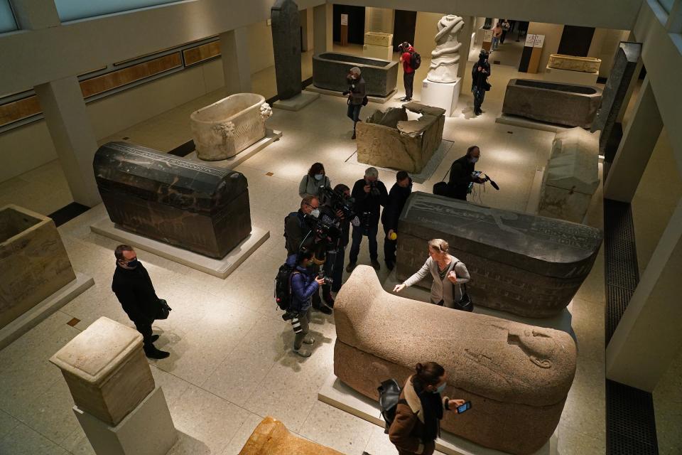 Friederike Seyfried points to a stain left by an assailant on the lid of an ancient Egyptian stone sarcophagusSean Gallup/Getty Images