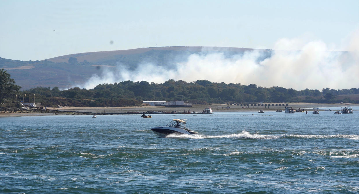 Heavy smoke rising from the scene on Studland Heath, Dorset, as a drought has been declared for parts of England following the driest summer for 50 years. Picture date: Friday August 12, 2022.