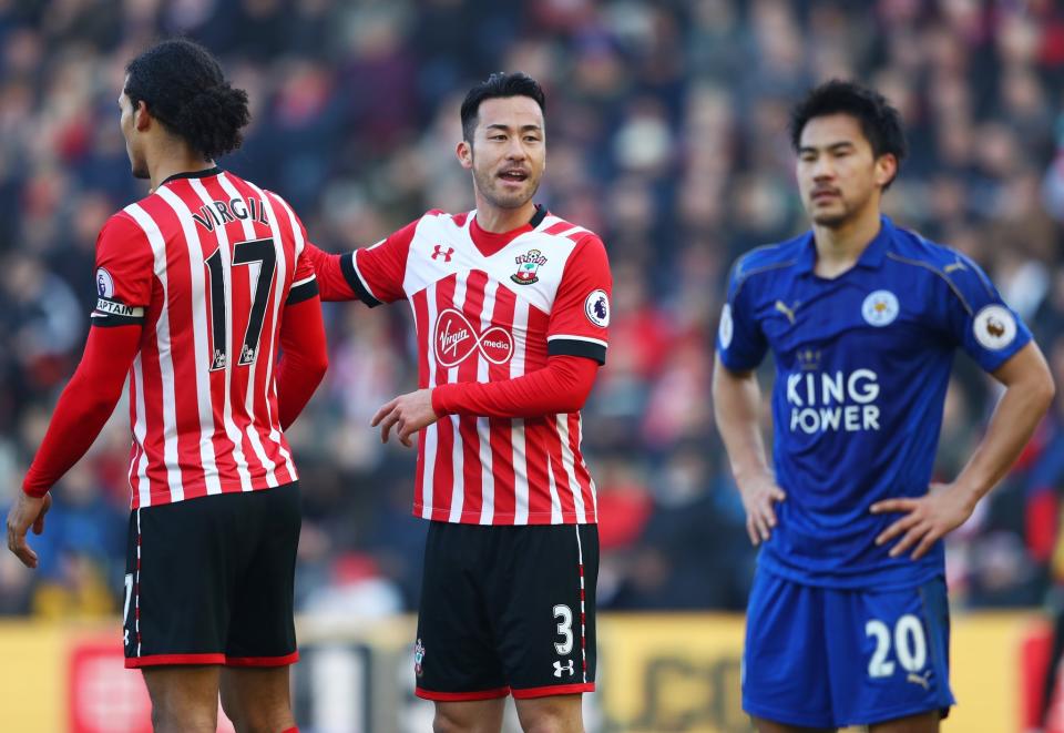 <p>Shinji Okazaki looks on frustrated as Maya Yoshida organises the defence </p>