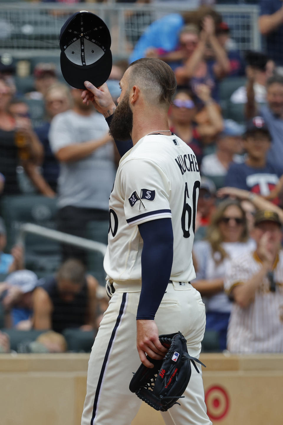 Minnesota Twins starting pitcher Dallas Keuchel tips his cap to the fans after giving up a double to Pittsburgh Pirates' Bryan Reynolds following six and 1/3rd perfect innings of pitching in the seventh inning of a baseball game Sunday, Aug. 20, 2023, in Minneapolis. (AP Photo/Bruce Kluckhohn)