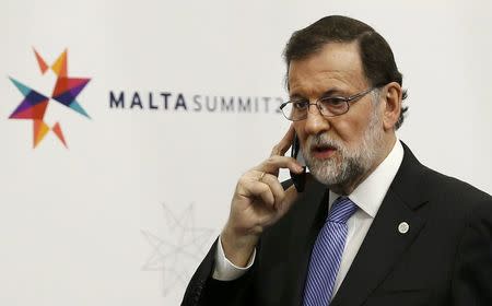 Spanish Prime Minister Mariano Rajoy speaks on his phone during the European Union leaders summit in Malta, February 3, 2017. REUTERS/Darrin Zammit-Lupi