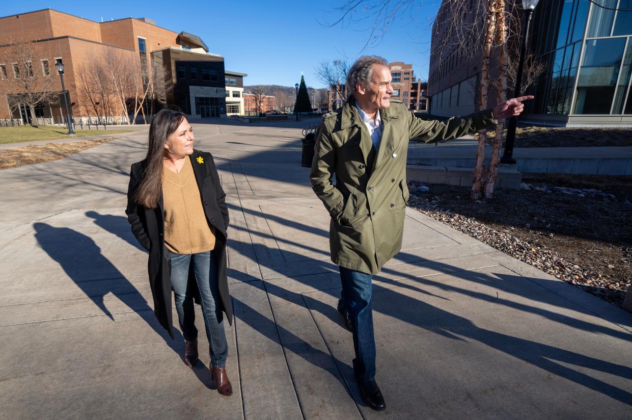 Ousted University of Wisconsin-La Crosse Chancellor Joe Gow, right, and his wife, Carmen Wilson walk across campus Friday, December 29, 2023 at UW-La Crosse in La Crosse, Wisconsin. The University of Wisconsin System Board of Regents unanimously fired Gow on Wednesday after discovering videos posted on porn websites featuring him and his wife.