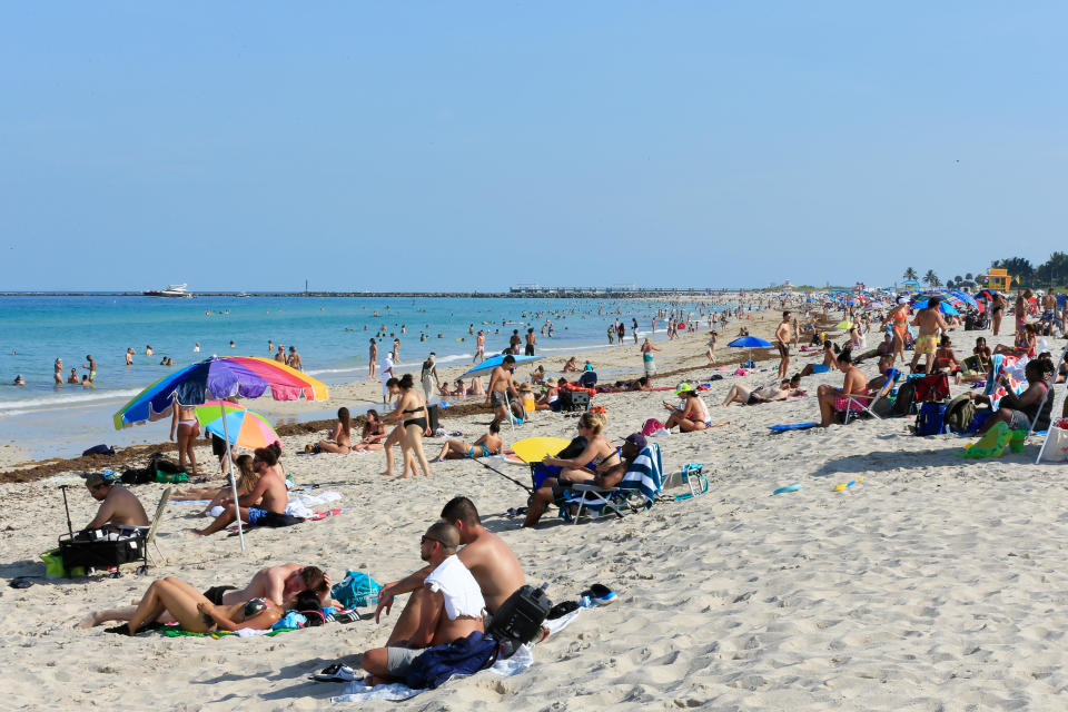 Beachgoers take advantage of the opening of South Beach on June 10, 2020 in Miami Beach, Florida.  / Credit: Cliff Hawkins/Getty Images