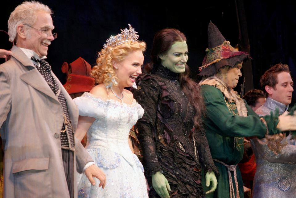 Joel Grey, Kristin Chenoweth, and Idina Menzel at curtain call of opening night of Wicked on October 30, 2003