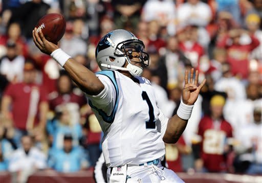 Carolina Panthers quarterback Cam Newton throws the ball during the first half of an NFL football game against the Washington Redskins Sunday, Nov. 4, 2012, in Landover, Md. (AP Photo/Alex Brandon)