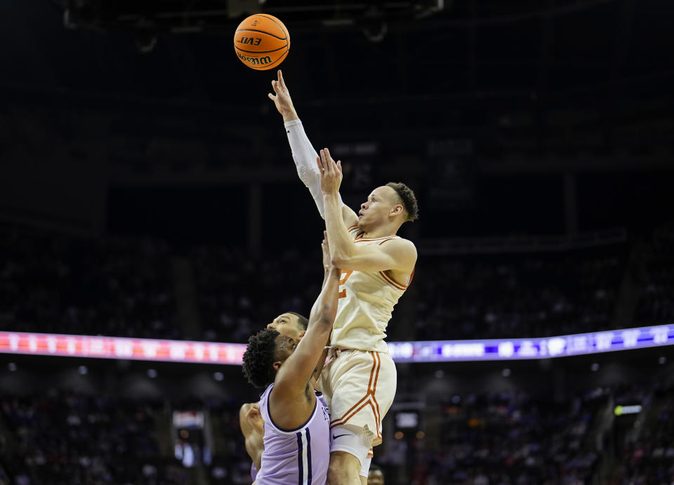 Chendall Weaver #2 of the Texas Longhorns shoots against Tylor Perry #2 of the Kansas State Wildcats during the first half in the second round of the Big 12 Men's Basketball Tournament at T-Mobile Center on March 13, 2024 in Kansas City, Missouri.  (Photo by Jay Biggerstaff/Getty Images)