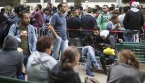 Migrants wait in front of the State Office for Health and Social Affairs (LaGeSo), in Berlin, Germany, September 3, 2015. REUTERS/Hannibal Hanschke