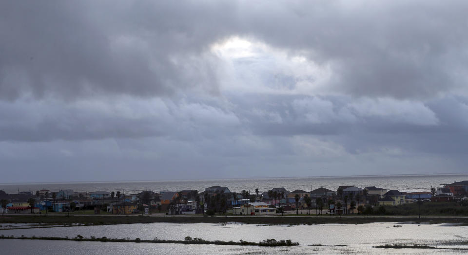 FILE - Sunshine makes its way through a break in the clouds on Sept. 22, 2020, in Surfside Beach, Texas. President Joe Biden's administration has approved construction of The Sea Port Oil Terminal, a deepwater oil export terminal off the Texas coast that would be the largest of its kind in the United States. Environmentalists called the move a betrayal of Biden’s climate agenda and said would lead to planet-warming greenhouse gas emissions equivalent to nearly 90 coal fired-power plants.(Godofredo A. Vasquez/Houston Chronicle via AP, File)