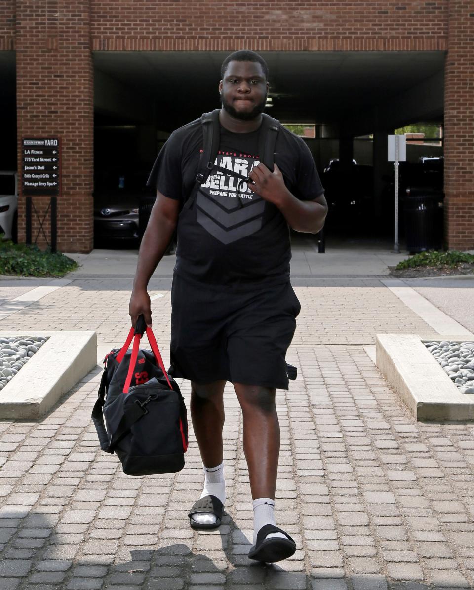 Matthew Jones checks in to the team hotel for camp on Aug. 8. 2021.