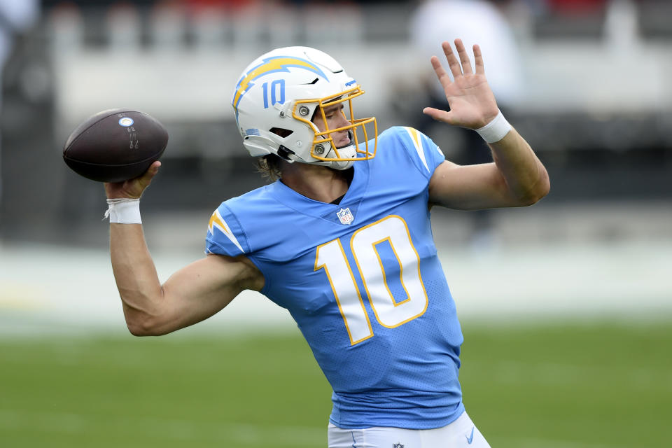 Los Angeles Chargers quarterback Justin Herbert (10) throws a pass before an NFL football game against the Tampa Bay Buccaneers Sunday, Oct. 4, 2020, in Tampa, Fla. (AP Photo/Jason Behnken)