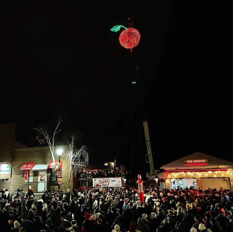 Crowds wait with anticipation as the 6-foot, brightly lit cherry descends from more than 100 feet in the air to bring in the new year at the stroke of midnight during last year's The Lodge Cherry Drop in Sister Bay. The giant cherry is back again for its annual Dec. 31 descent, along with fireworks, fresh beer, music and outdoor activities.
