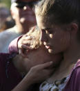 <p>Abigail Adams, right, comforts her friend Hannah Hershey, 13, during a vigil for the victims of the Santa Fe High School shooting Friday, May 18, 2018, in Santa Fe, Texas. Hershey said she knew one of the people who were killed at the high school earlier that day. (Photo: Godofredo A. Vasquez/Houston Chronicle via AP) </p>