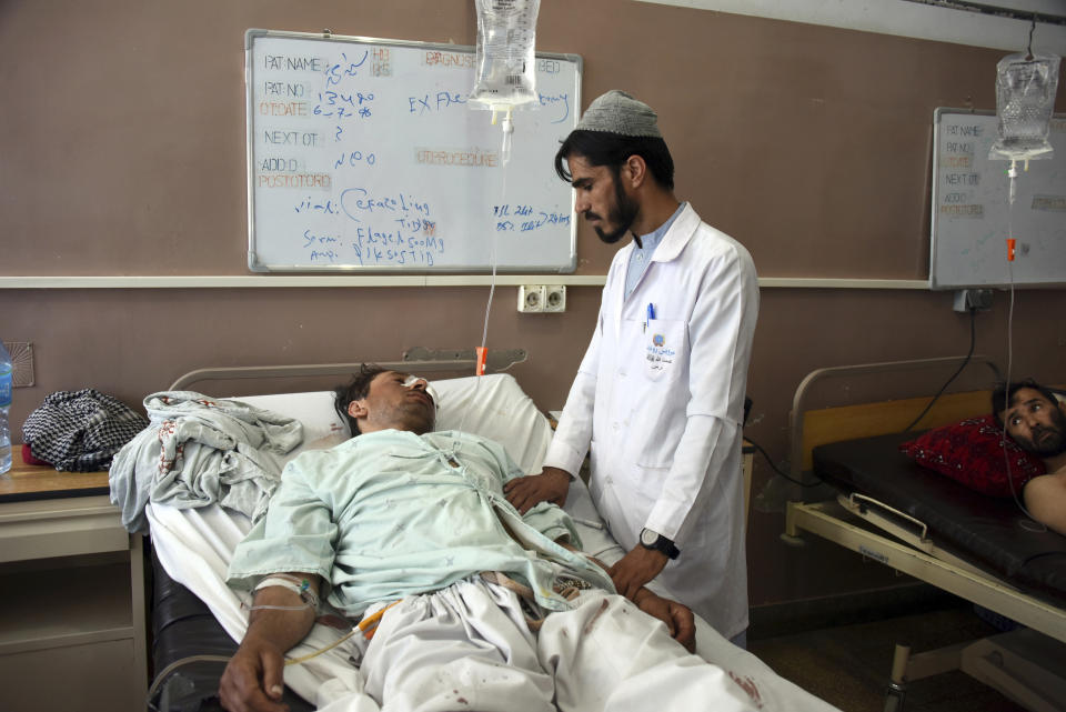 Wounded Afghans lie on a bed at a hospital after a bomb attack on a local mosque in Kandahar province, south of Kabul, Afghanistan, Saturday, Sept. 28, 2019. Afghans headed to the polls on Saturday to elect a new president amid high security and threats of violence from Taliban militants, who warned citizens to stay away from polling stations or risk being hurt. One of the first reports of violence came from southern Afghanistan, the former spiritual heartland of the Taliban. (AP Photo/AP Photo)