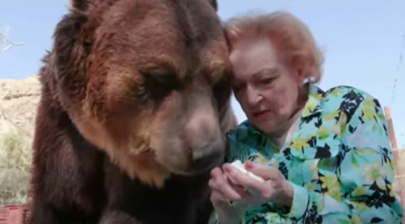 Betty White feeds a grizzly bear, from the documentary Betty White: First Lady of Television.