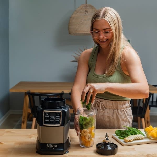 person using the blender