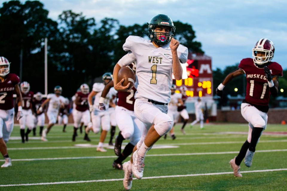 West's Skyler Geurink takes the ball up the field during a game against Muskegon Friday, Sept. 23, 2022, at Muskegon's Hackley Stadium. 