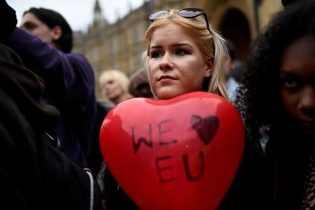 Demonstrators listen to speeches outside the Houses of Parliament as they take part in a protest aimed at showing London's solidarity with the European Union following the recent EU referendum, in central London, Britain June 28, 2016. REUTERS/Dylan Martinez