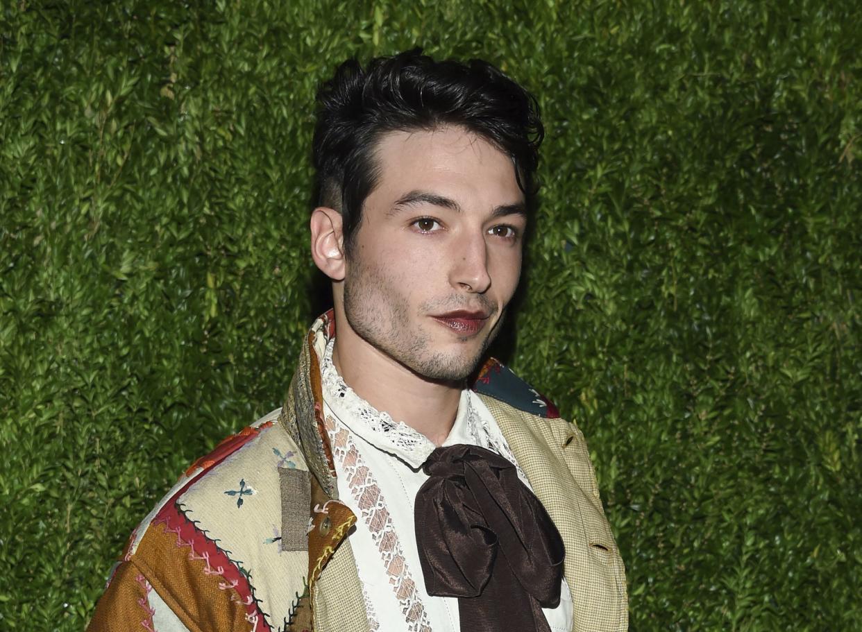 FILE - Ezra Miller attends the 15th annual CFDA/Vogue Fashion Fund event at the Brooklyn Navy Yard in New York, Nov. 5, 2018. 
