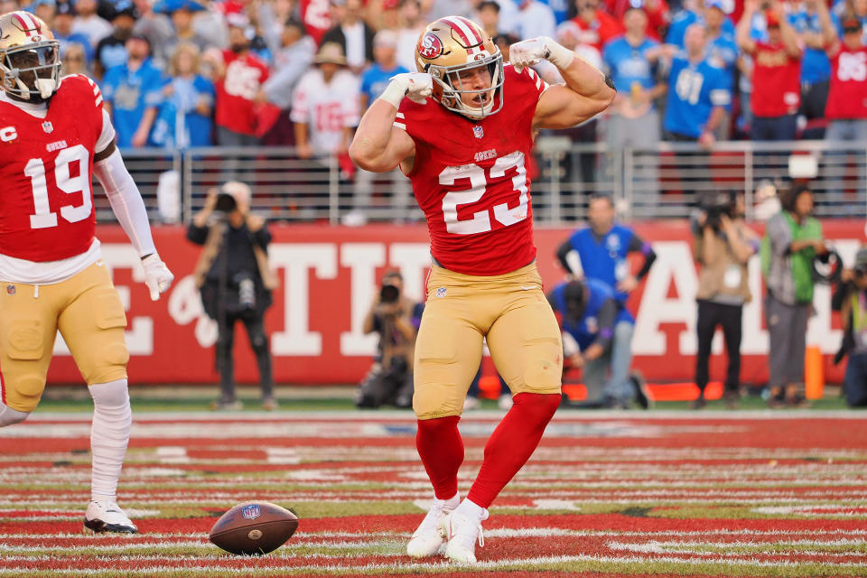 Jan 28, 2024; Santa Clara, California, USA; San Francisco 49ers running back Christian McCaffrey (23) celebrates after scoring a touchdown against the <a class="link " href="https://sports.yahoo.com/nfl/teams/detroit/" data-i13n="sec:content-canvas;subsec:anchor_text;elm:context_link" data-ylk="slk:Detroit Lions;sec:content-canvas;subsec:anchor_text;elm:context_link;itc:0">Detroit Lions</a> during the first half of the NFC Championship football game at Levi’s Stadium. Mandatory Credit: Kelley L Cox-USA TODAY Sports