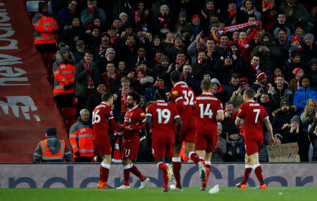 Soccer Football - Premier League - Liverpool vs Watford - Anfield, Liverpool, Britain - March 17, 2018 Liverpool's Mohamed Salah celebrates scoring their second goal with team mates REUTERS/Phil Noble