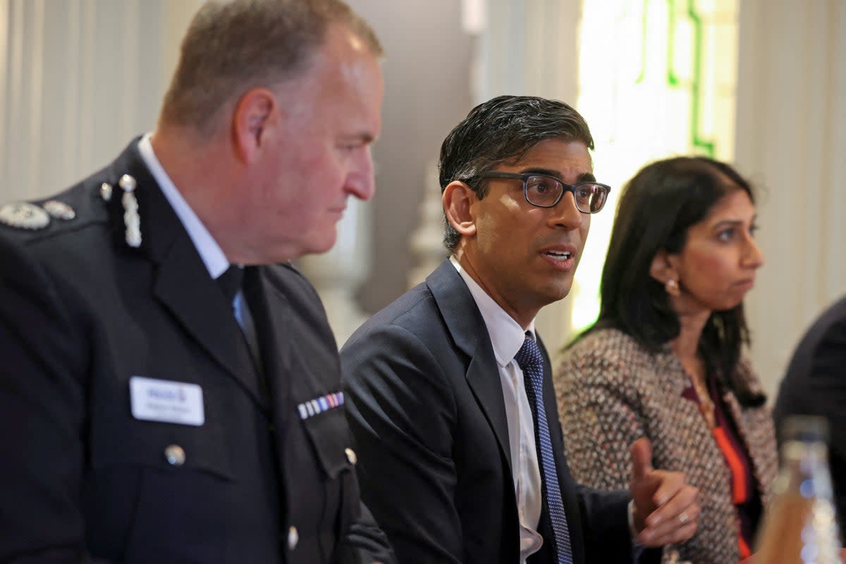 Rishi Sunak and Suella Braverman with police leaders during a visit to Rochdale on Monday (PA)