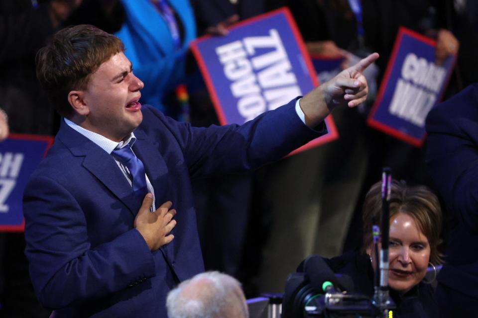 Gus, the son of U.S. Democratic vice presidential nominee Minnesota Governor Tim Walz, reacts on Day 3 of the Democratic National Convention (DNC) at the United Center, in Chicago, Illinois, U.S., August 21, 2024.