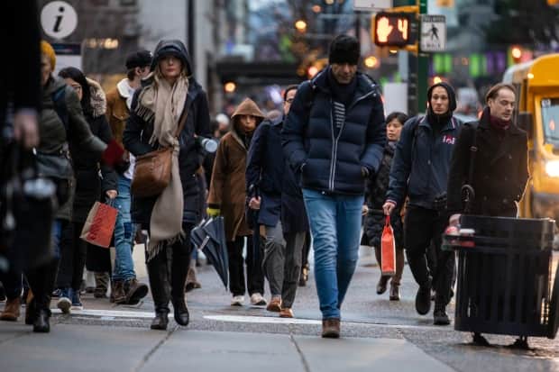 Pedestrians in Vancouver on Dec. 17, 2019. Metro Vancouver planners anticipate the region will grow by more than one million people by 2050.  (Ben Nelms/CBC - image credit)