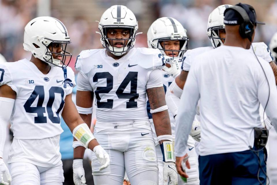 Linebacker Ta’Mere Robinson listens to Anthony Poindexter during the Penn State Blue-White game on Saturday, April 15, 2023.