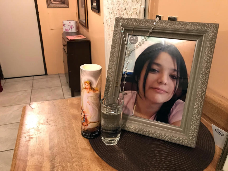 A framed photo of Melissa Ramirez sits at the end of a makeshift altar in her mother's home in Rio Bravo, Texas, on Tuesday, Sept. 18, 2018. (AP Photo/Susan Montoya Bryan)