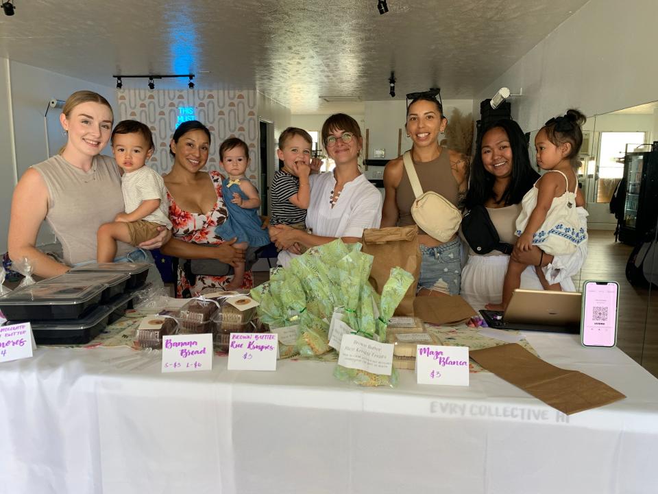 Members of The Mom Walk Collective group, who held a bake sale in Hilo, Hawaii on August 22, 2023 to raise money for two moms from their sister group in Maui who lost their homes in the fires on August 8, 2023.