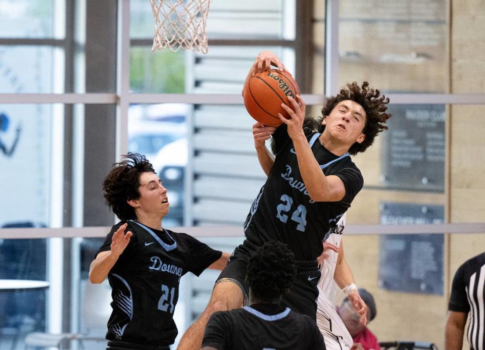 Downey’s Joseph Ramirez grabs a rebound during the Mark Gallo Invitational Basketball Tournament game with El Capitan at Central Catholic High School in Modesto, Calif., Saturday, Dec. 9, 2023.