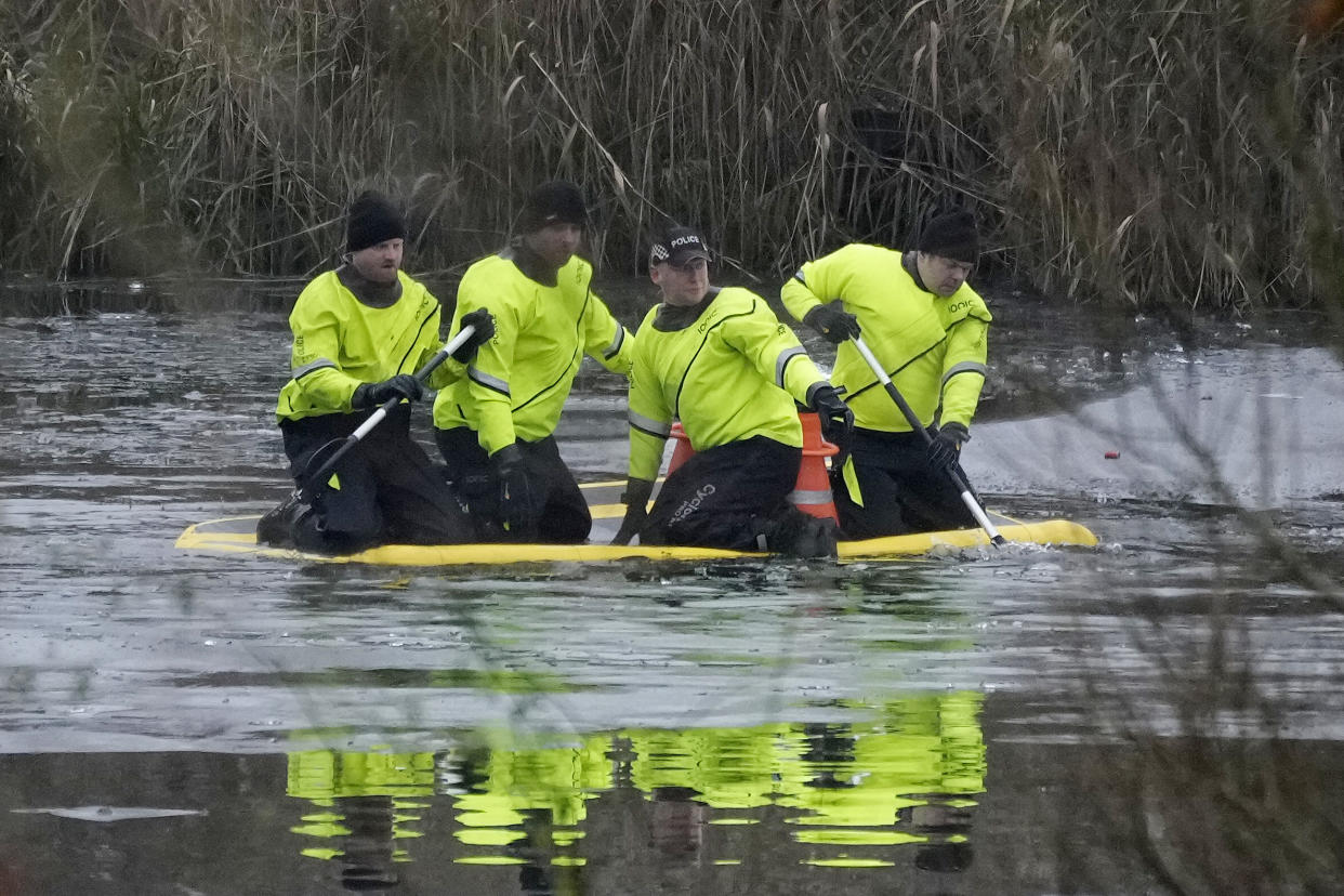 SOLIHULL, ENGLAND - DECEMBER 12: Emergency workers continue the search for further victims after a number of children fell through ice on a lake, on December 12, 2022 at Babbs Mill Park in Solihull, England. Three boys aged eight, 10 and 11 have died after falling through an icy lake last night. The search continued for more potential victims, following reports more children were present on the ice at the time of the incident. (Photo by Christopher Furlong/Getty Images)