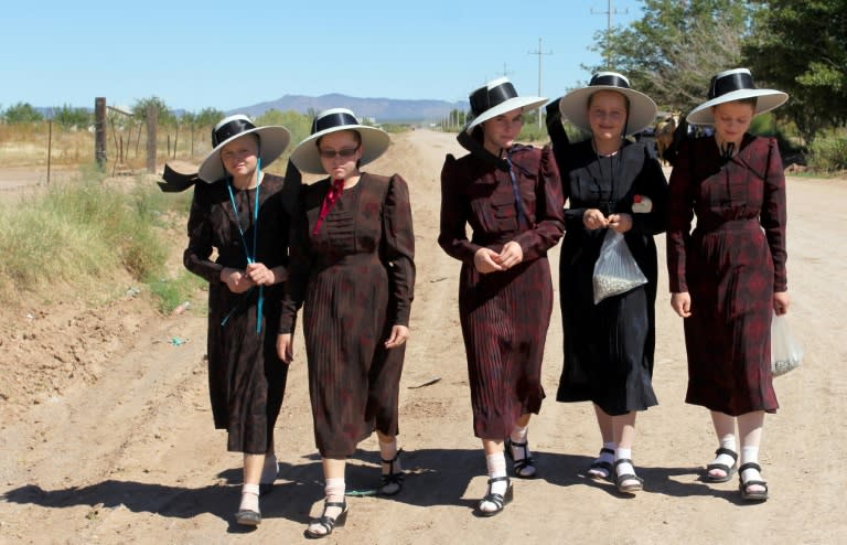 Mennonite women wear conservative, loose-fitting dresses and cover their heads