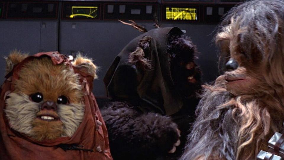 Two Ewoks in an AT-ST cockpit with Chewbacca in Return of the Jedi