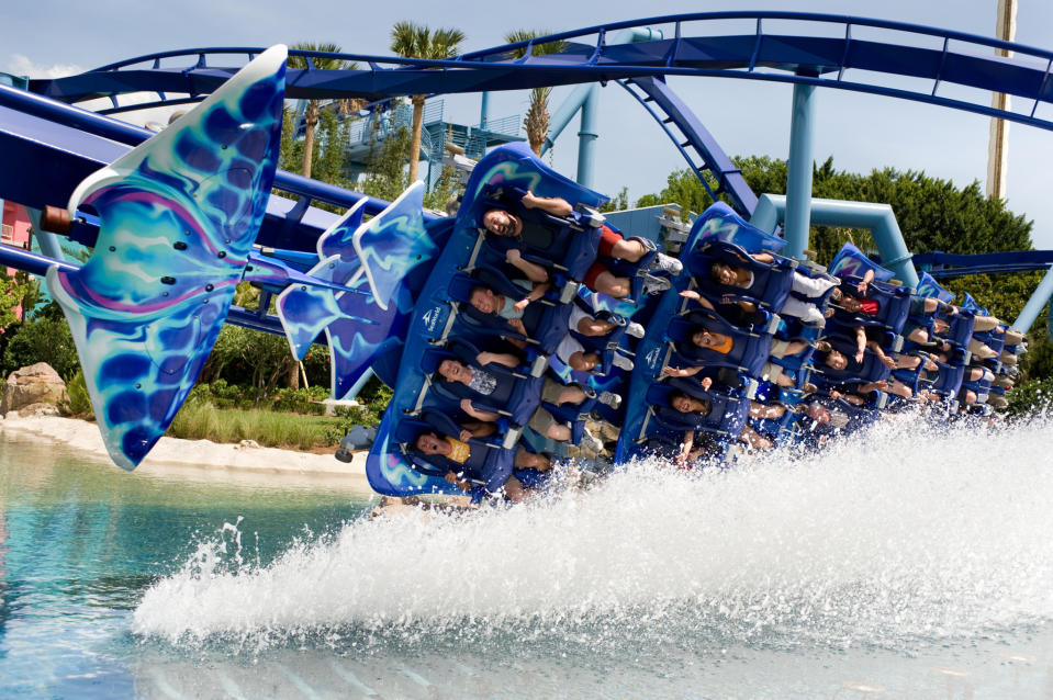 Manta roller coaster at SeaWorld Orlando splashing along the water.