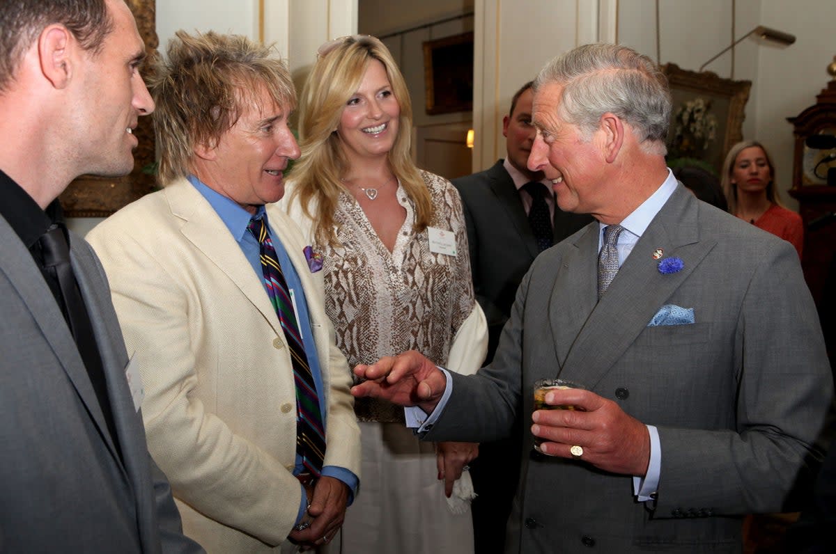 Rod Stewart and Penny Lancaster are greeted by King Charles III (Tim Whitby/PA) (PA Archive)